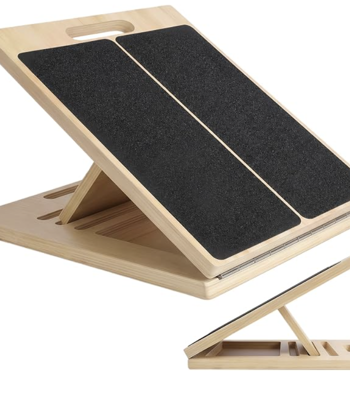 Adjustable wooden slant board with non-slip pads, shown upright